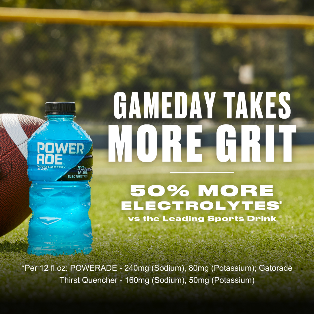 Gameday takes more grit. 50% more electrolytes vs the leading sports drink. Hand holding a football down on the grass